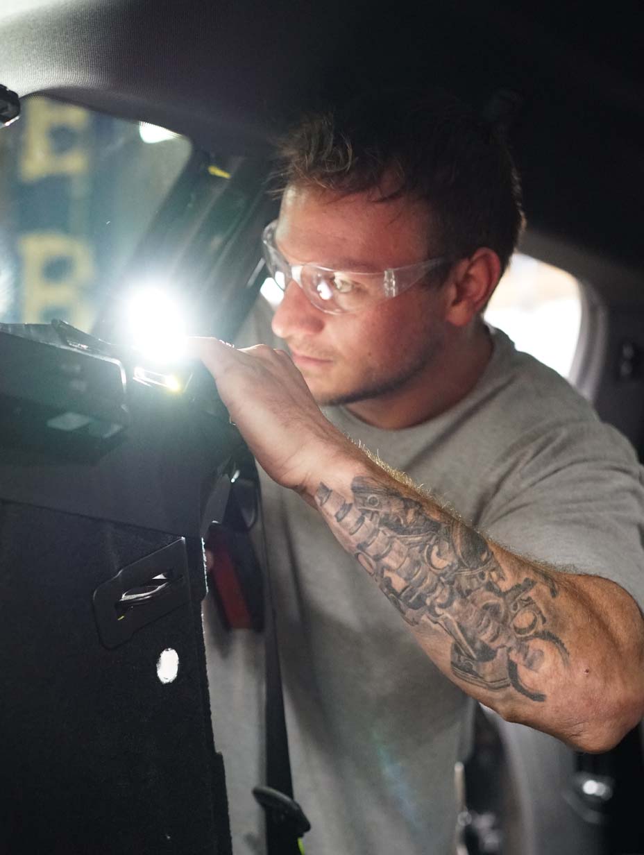 Technician repairing a vehicle